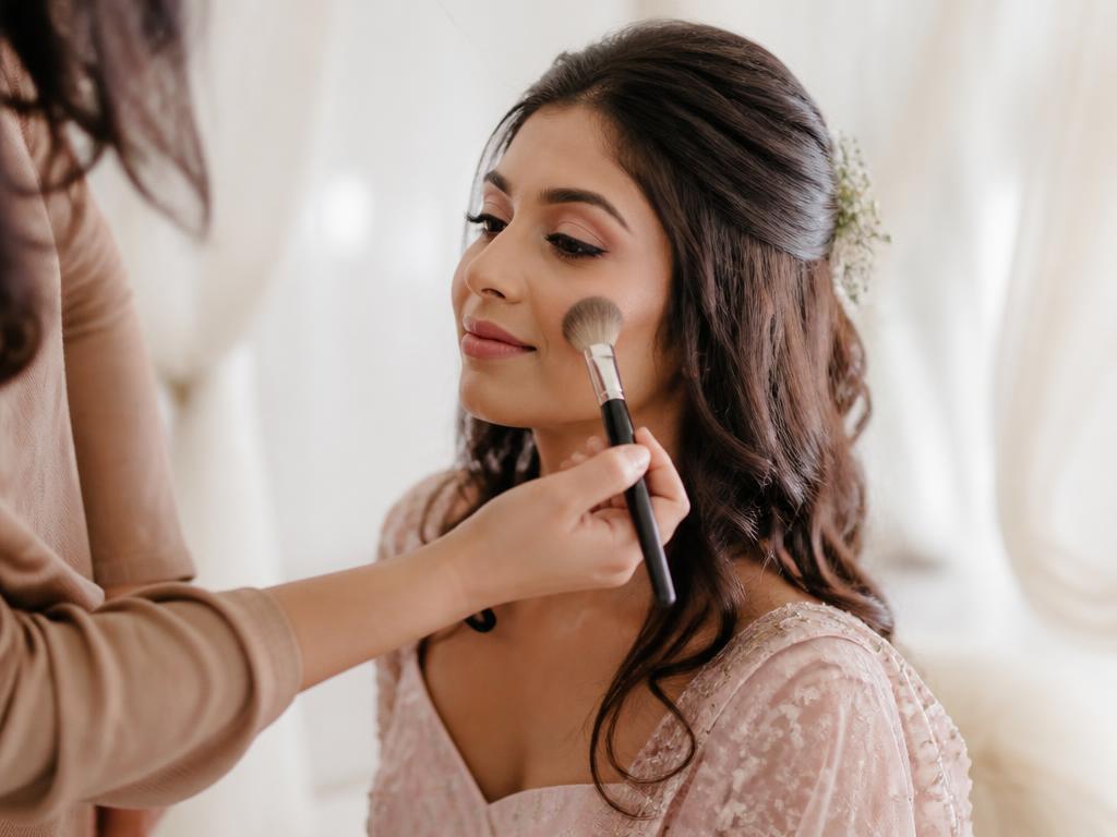 Soft glam pre-wedding makeup being applied